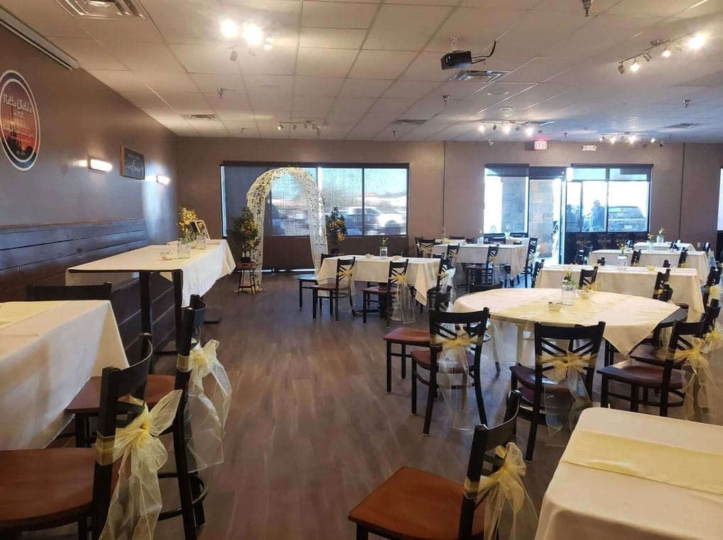 Netta Cheta's on Mill restaurant with tables and chairs ready for an event.