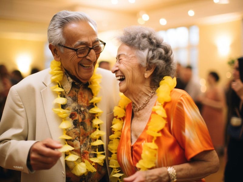 Two people dressed in a Hawaiian beach theme for a retirement party.